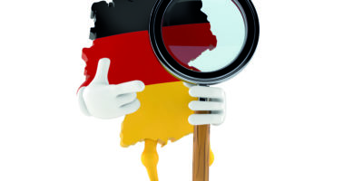 Deutscher Charakter mit Lupe isoliert auf weißem Hintergrund. 3D-Darstellung