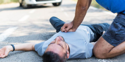 man receiving first aid after a car accident