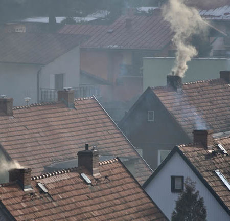Houses and dirty smoke from the chimney
