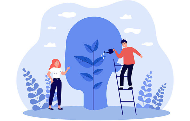 Themenbild Psychologie: Kleine Frau und Mann pflegen eine Pflanze in einem grossen Kopf